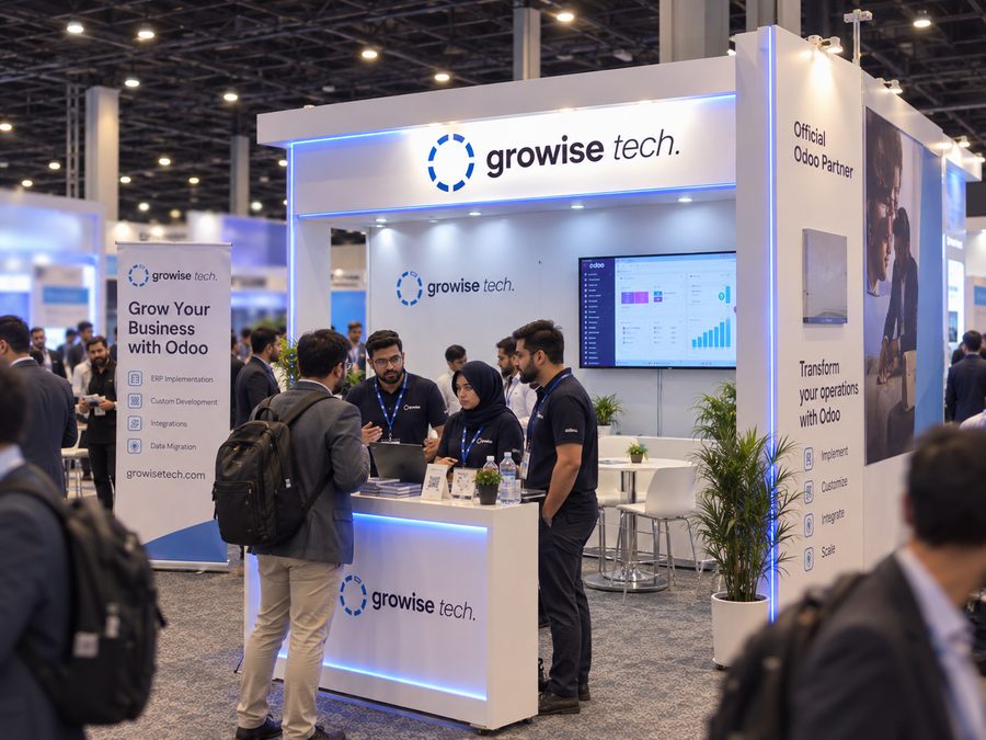 Two of the Growise Tech team talking a visitor through Odoo at the stand